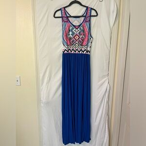 Long flowing dress with colorful top and cobalt blue skirt.